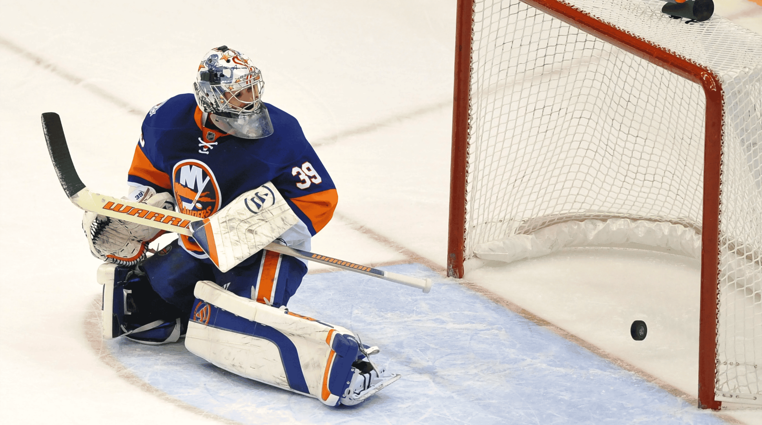 Former New York Islanders goaltender Rick DiPietro letting in a goal.